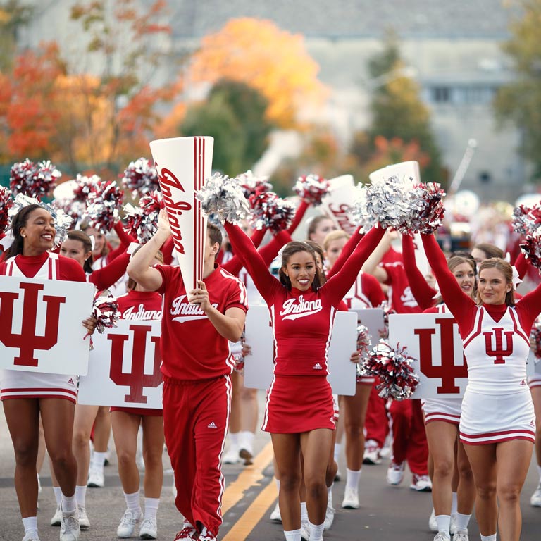 IU cheerleaders march in a parade